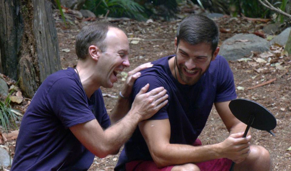 Matt Hancock laughs with campmate and fellow finalist Owen Warner. (Shutterstock/ITV)