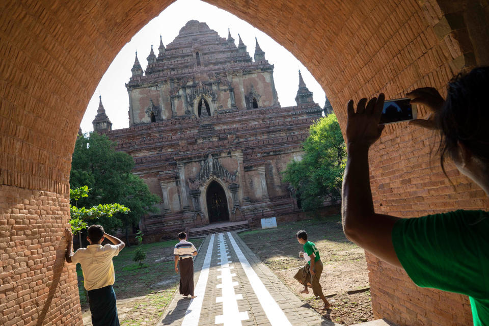 <p>A visitor takes a photo of the Sulamani Guphaya temple, which was damaged after a strong earthquake hit Bagan, Myanmar, Thursday, Aug. 25, 2016. (AP Photo/Hkun Lat) </p>