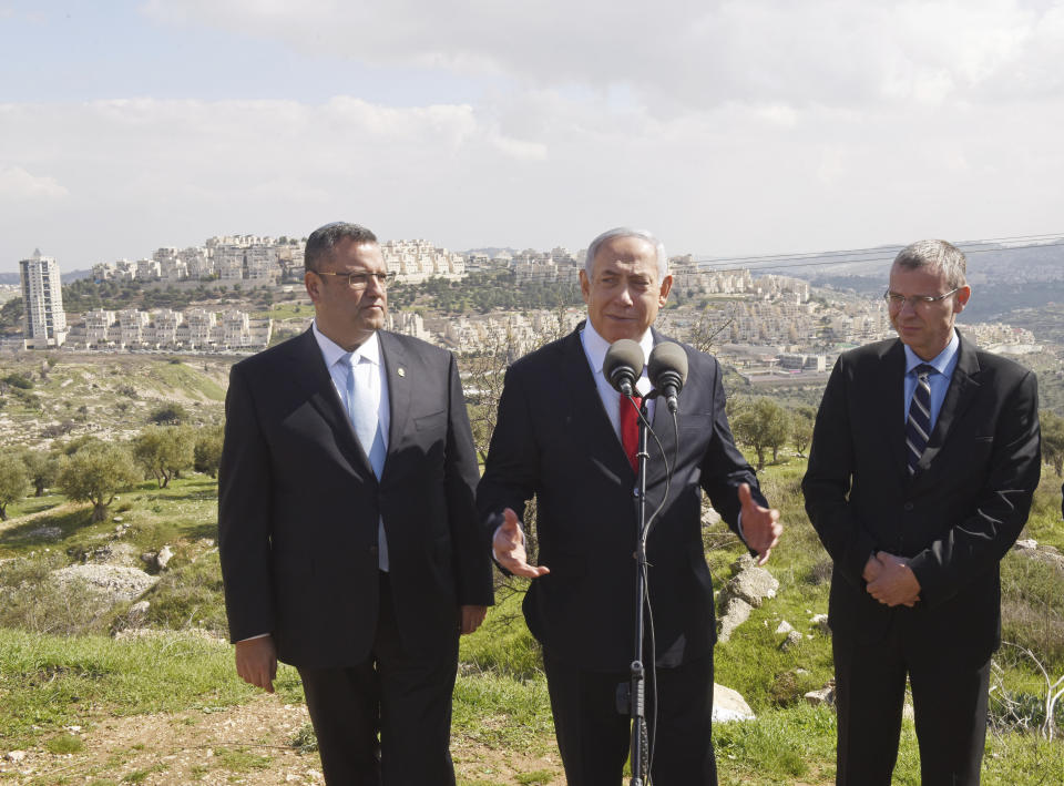 Israeli Prime Minister Benjamin Netanyahu announces a new neighborhood that is to be built in the Israeli West Bank Israeli settlement of Har Homa, Thursday, Feb. 20, 2020. (Debbie Hill/Pool via AP)