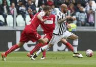 Football Soccer - Juventus v Carpi - Italian Serie A - Juventus stadium, Turin, Italy - 01/05/16 Juventus' Simone Zaza in action against Carpi's Emanuele Suagher. REUTERS/Stefano Rellandini