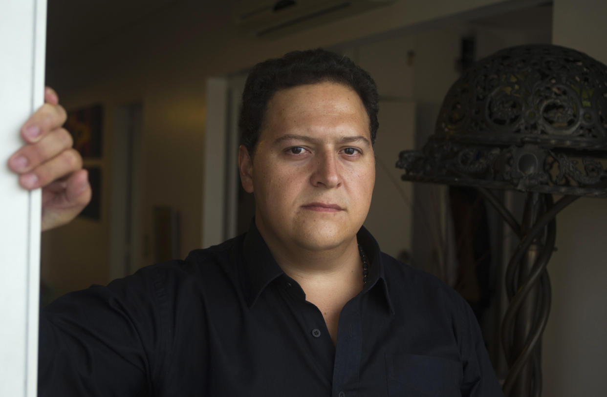 Sebastian Marroquin, son of Colombia's late drug lord Pablo Escobar, poses for a portrait at his home in Buenos Aires, Argentina, Friday, Aug. 17, 2012. Marroquin, who legally changed his name and moved to Argentina in 1994 with his mother Maria Valeria Henao after his father was killed, says he created a clothing collection as a way to send a message of peace and reflection about his family's history. (AP Photo/Eduardo Di Baia)