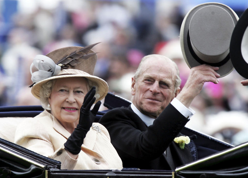 YORK, ENGLAND - JUNE 16: The Queen and Prince Phillip are seen arriving in the Royal Carriage on the third day of Royal Ascot 2005, Ladie's Day, at York Racecourse on June 16, 2005 in York, England. One of the highlights of the racing and social calendars, Royal Ascot was founded in 1711 by Queen Anne and royal patronage continues to the present day with a Royal Procession taking place in front of the grandstands each day. This year's Royal Meeting is relocated to York Racecourse due to a major redevelopment programme at Ascot, due to re-open in 2006. (Photo by Chris Jackson/Getty Images)  *** Local Caption *** Queen Elizabeth II; Prince Phillip