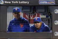 New York Mets manager Luis Rojas, right, watches his team play during the first inning of a baseball game against the Miami Marlins, Thursday, Sept. 30, 2021, in New York. (AP Photo/Frank Franklin II)