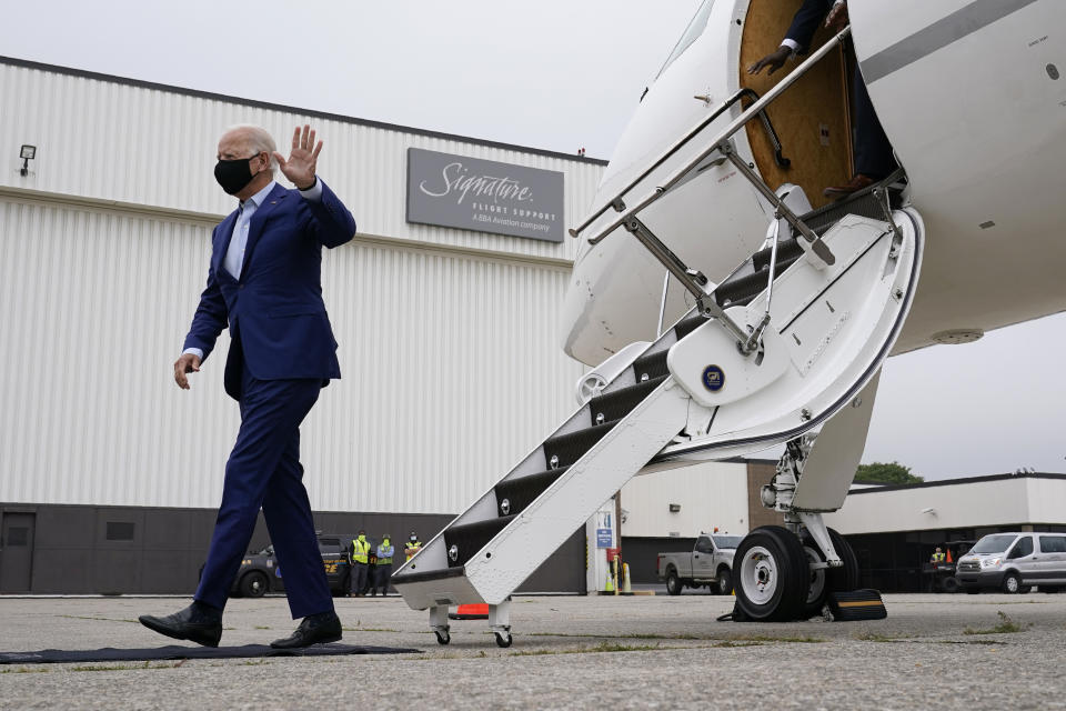 Democratic presidential candidate former Vice President Joe Biden waves as he steps off a plane at Detroit Metropolitan Wayne County Airport in Detroit, Wednesday, Sept. 9, 2020. Biden is attending campaign events in Michigan. (AP Photo/Patrick Semansky)