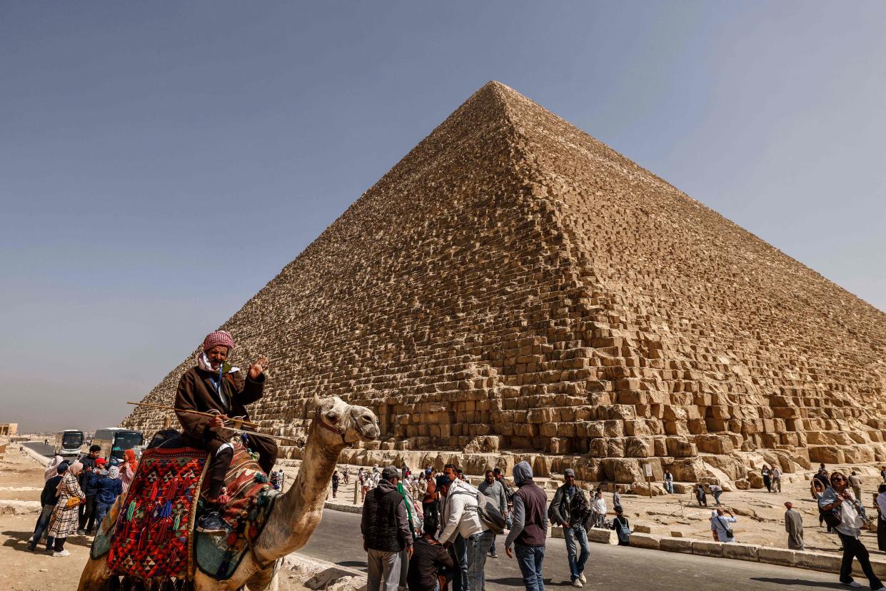 Tourists visit the Great Pyramid of Khufu (Cheops) at the Giza Pyramids necropolis on the southwestern outskirts of Cairo, on March 2, 2023.