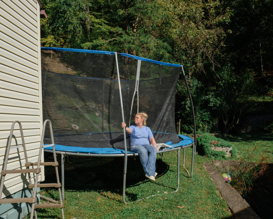 Portraits of Jackie at her home in Charleston. Sitting on the trampolene that her and her daughers enjoyed jumping on.   (Stephanie Mei-Ling for NBC News and ProPublica)