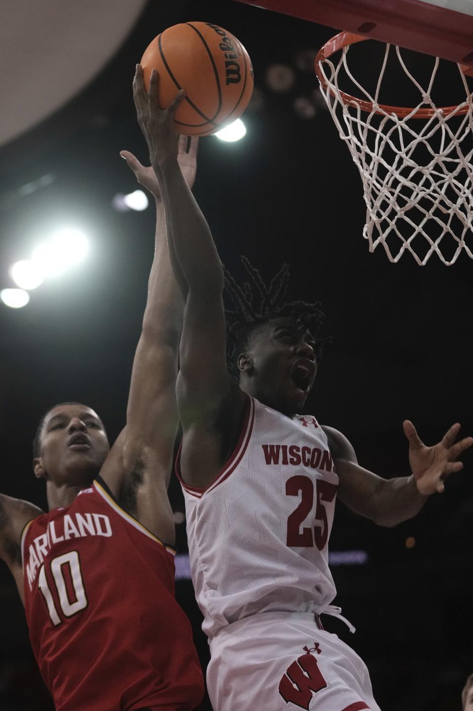 Wisconsin's John Blackwell shoots past Maryland's Julian Reese during the second half of an NCAA college basketball game Tuesday, Feb. 20, 2024, in Madison, Wis. (AP Photo/Morry Gash)