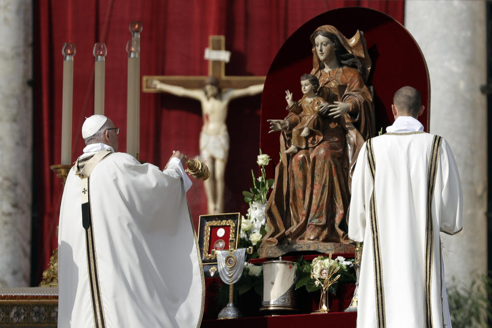 Pope Francis incenses the relics during a canonization ceremony in St. Peter's Square at the Vatican, Sunday, Oct. 14, 2018. Pope Francis canonizes two of the most important and contested figures of the 20th-century Catholic Church, declaring Pope Paul VI and the martyred Salvadoran Archbishop Oscar Romero as models of saintliness for the faithful today. (AP Photo/Andrew Medichini)