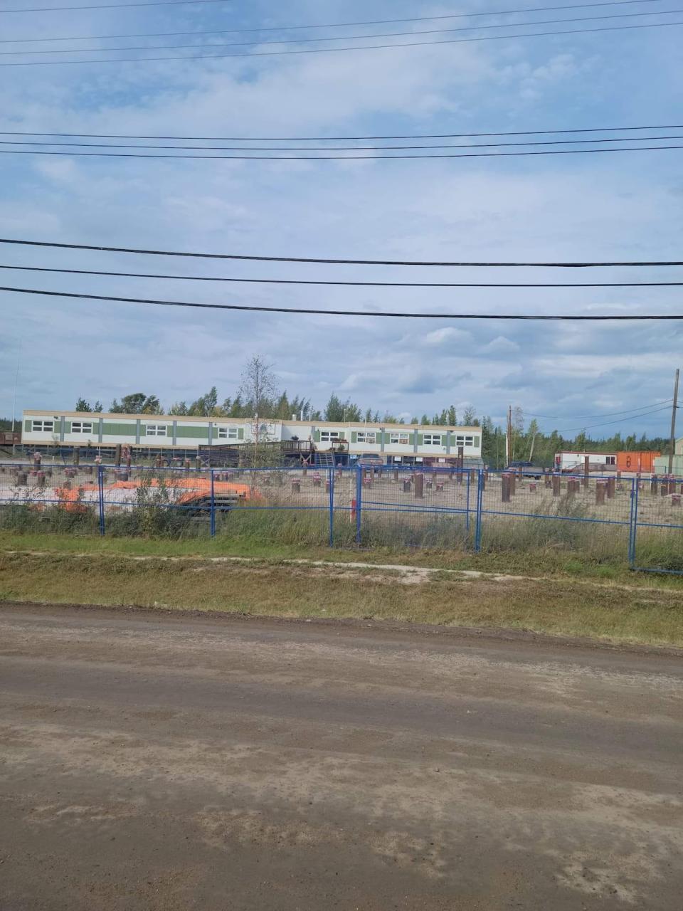 A site for the facility has been identified with piles already driven into the fenced off area as part of the building’s foundation. Other construction materials are also in the community sitting in storage. 