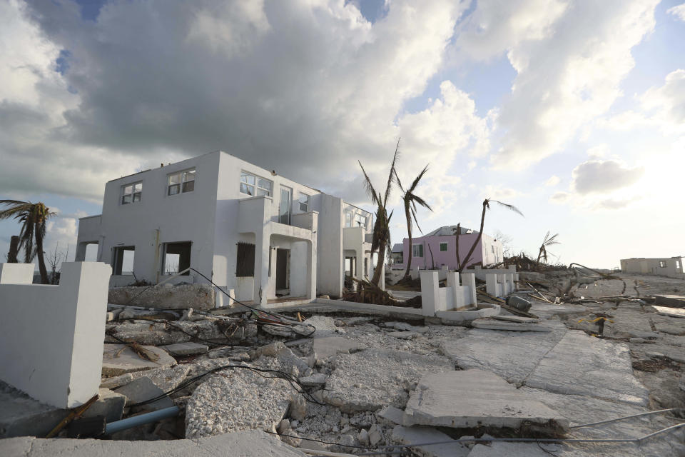 Destruction caused by Hurricane Dorian is seen in Eastern Shores, just outside Marsh Harbor, Abaco Island, Bahamas, Saturday, Sept. 7, 2019. The Bahamian health ministry said helicopters and boats are on the way to help people in affected areas, though officials warned of delays because of severe flooding and limited access. (AP Photo/Fernando Llano)