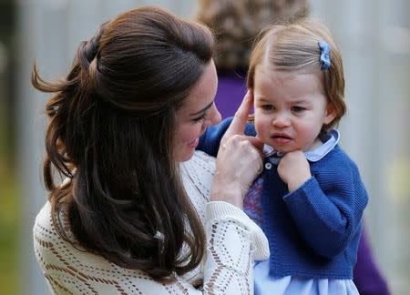 Britain's Catherine, Duchess of Cambridge, holds Princess Charlotte at a children's party at Government House in Victoria, British Columbia, Canada, September 29, 2016. REUTERS/Chris Wattie