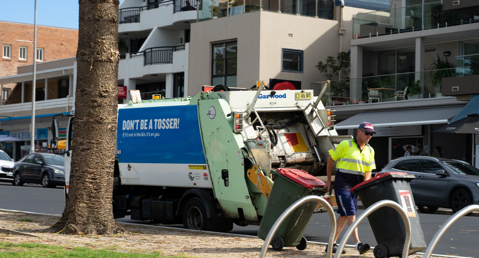 A garbage man collecting waste at Dee Why in Sydney. 