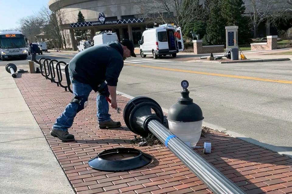 A street light is fixed at UConn in Storrs, Conn., Tuesday, April 4, 2023.