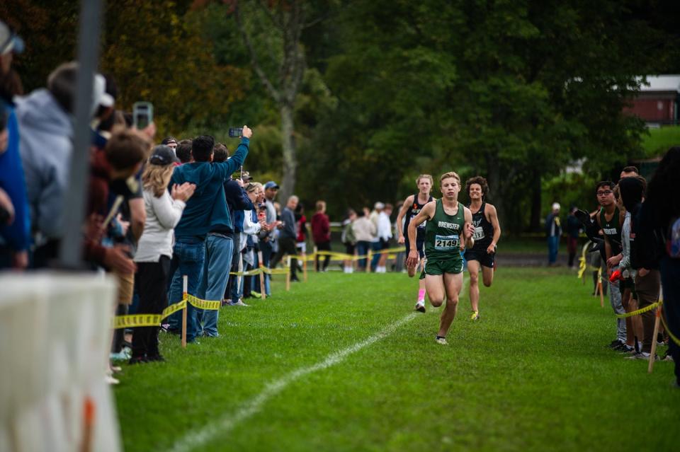 Brewster's Liam Ford races to a third-place finish in the boys varsity 1 race ahead of Newburgh Free Academy's Devin Batelic and Hackley's Ignacio Castro during the Brewster Bear Cross-Country Classic Sunday, October 8, 2023.
