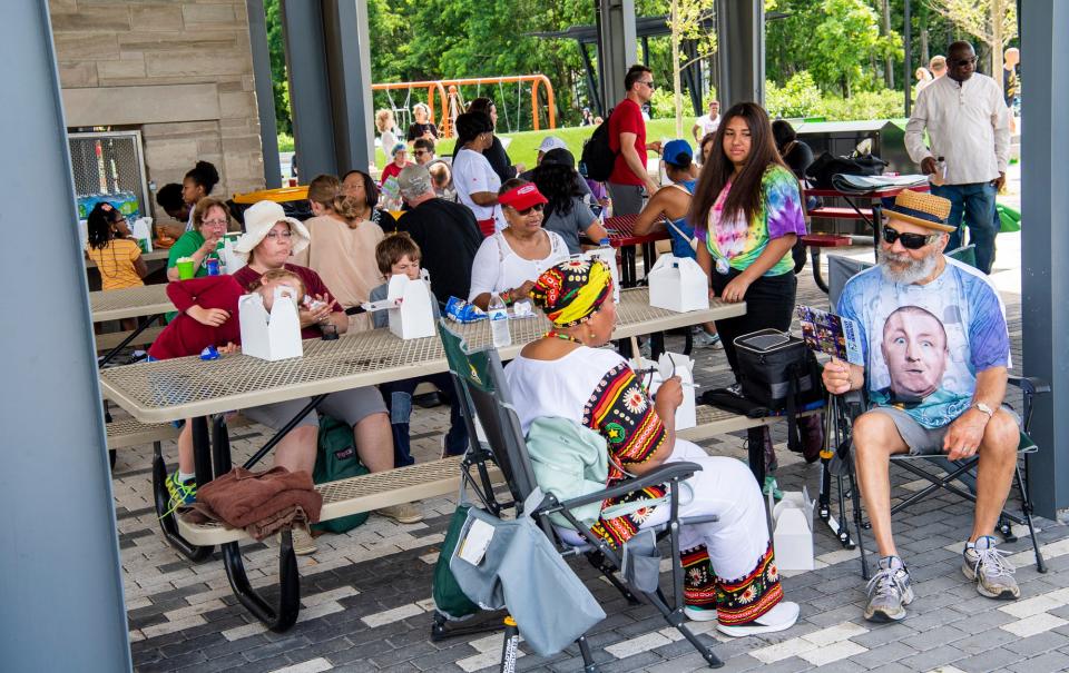 Attendees enjoy free food and good company June 19, 2021, at the Bloomington Juneteenth Day of Freedom celebration at Switchyard Park.