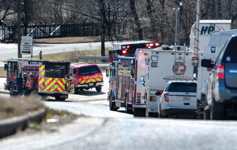 Emergency personnel gather outside of the Foundation Food Group site Thursday, Jan 28, 2021, in Gainesville, Ga., following a liquid nitrogen leak that killed six people. 