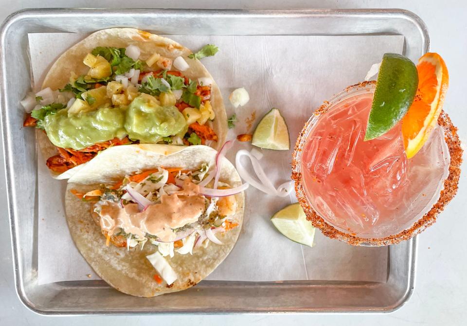 Chicken pastor and grilled shrimp tacos and a blood orange margarita on the rocks made with alcohol-free tequila at el Barrio in Athens, Ga. on Wednesday, July 12, 2023.