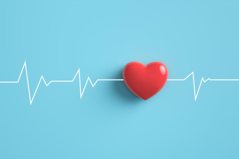 Cardiogram pulse trace with Red heart on pastel blue background. 3D rendering.