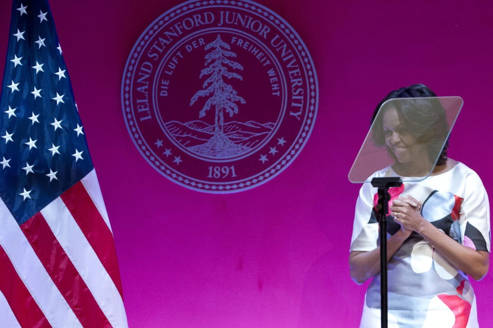 U.S. first lady Michelle Obama smiles after she gave a speech at Stanford Center in the Peking University in Beijing, China, Saturday, March 22, 2014. (AP Photo/Alexander F. Yuan)