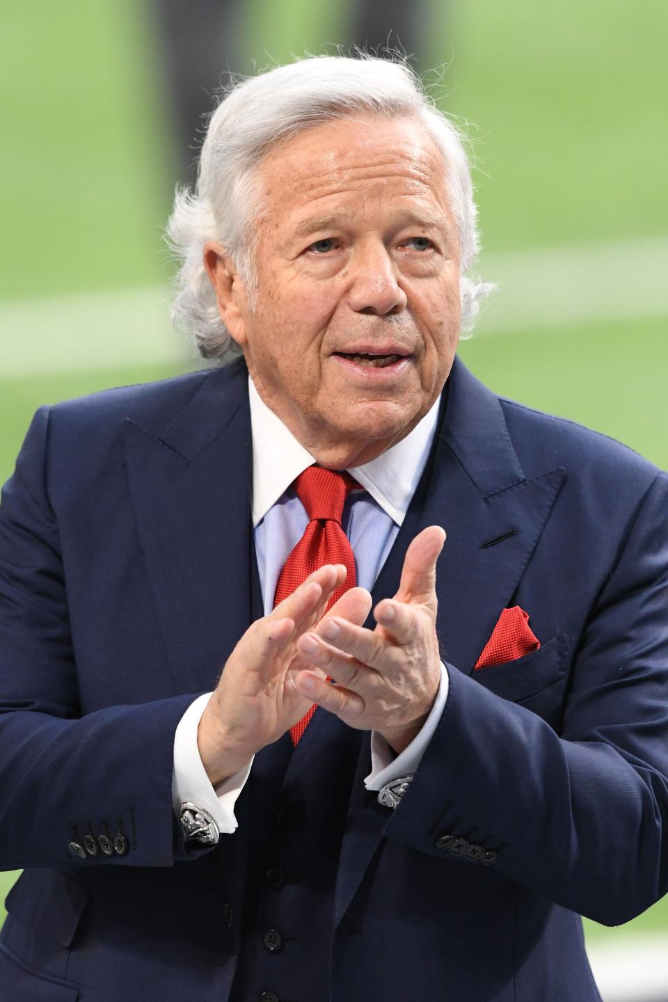 New England Patriots owner Robert Kraft looks on from