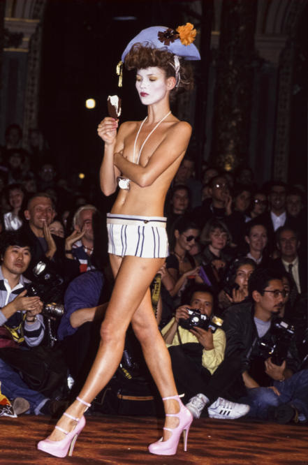 Vivienne Westwood Backstage Paris Spring Summer Brtitish Supermodel Kate  Moss having her yellow skirt fitted by designer Stock Photo - Alamy