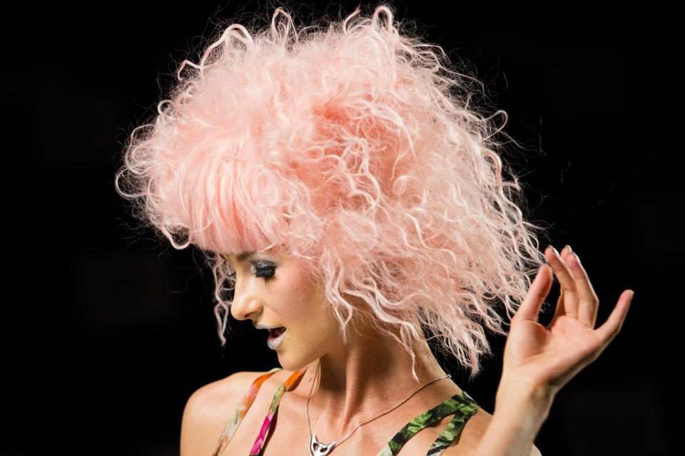 A model rehearses on the runway before the Betsey Johnson Spring 2014 collection is modeled during Fashion Week in New York, Wednesday, Sept. 11, 2013. (AP Photo/John Minchillo)