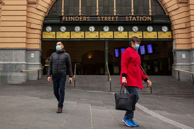 FILE PHOTO: People are seen outside of Flinders Street Station in Melbourne