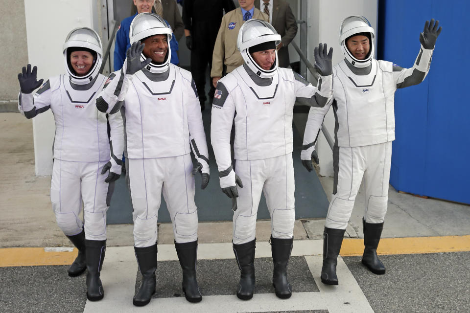 NASA astronauts, from left, Shannon Walker, Victor Glover, and Michael Hopkins and Japan Aerospace Exploration Agency astronaut Soichi Noguchi leave the Operations and Checkout Building on their way to launch pad 39A for the SpaceX Crew-1 mission to the International Space Station at the Kennedy Space Center in Cape Canaveral, Fla., Sunday, Nov. 15, 2020. (Photo/John Raoux)