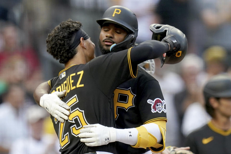 Pittsburgh Pirates' Endy Rodriguez, left, congratulates Liover Peguero after he hit a two-run home run against the Detroit Tigers in the second inning of a baseball game in Pittsburgh, Tuesday, Aug. 1, 2023. (AP Photo/Matt Freed)