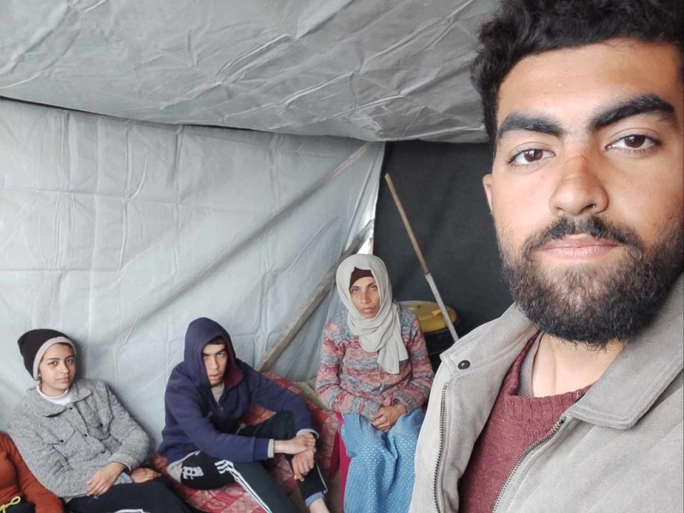 Members of Dr Ghayyda’s family huddle for warmth in a tent (Salim Ghayyda)