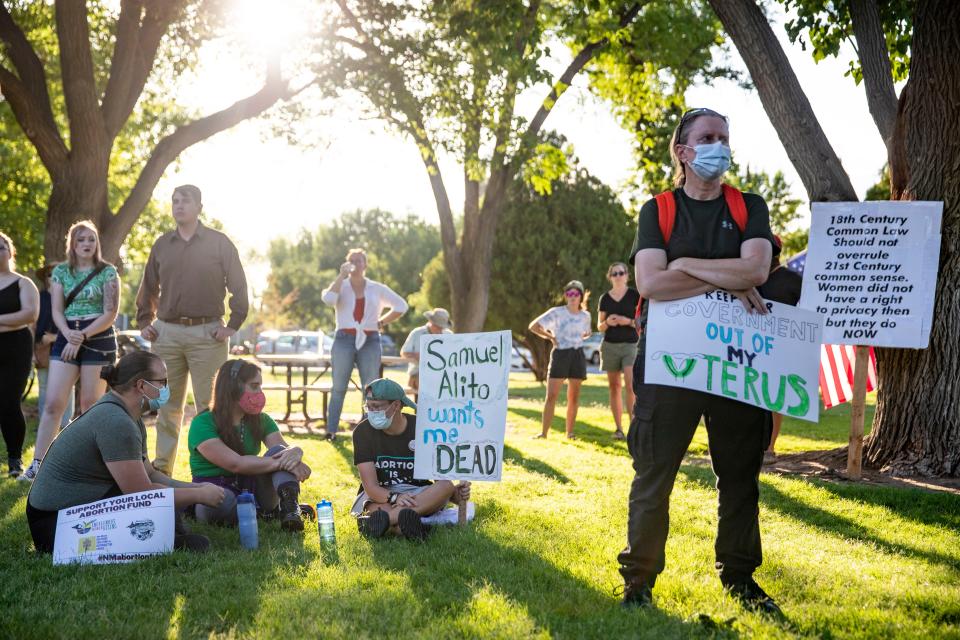 Demonstrators listen to abortion rights activists and other demonstrators share their feelings and fears about the overturning of Roe v. Wade during the Bans Off Las Cruces abortion rights demonstration on Friday, June 24, 2022. 