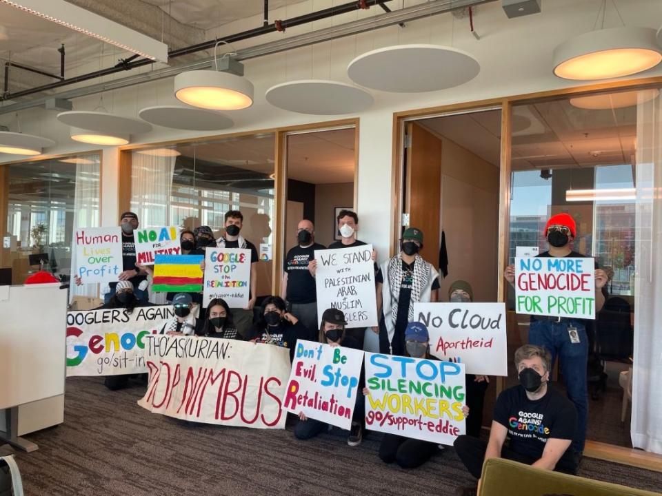 A large group of Google employees hold signs protesting their company’s participation in “Project Nimbus.” X/@NoTechApartheid