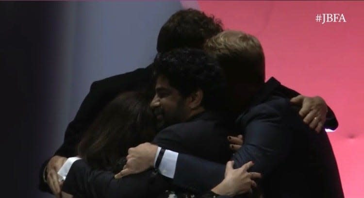 Meherwan and Molly Irani, founders of Chai Pani, share a huge with their team after winning Outstanding Restaurant at the James Beard Awards in Chicago on June 13, 2022.