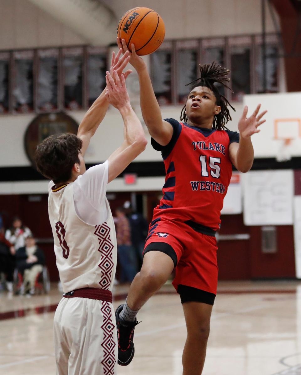 Tulare Western's Jaydon Henningham goes up a layup against Tulare Union during their 72nd annual Polly Wilhelmsen Invitational Basketball Tournament semifinal game in Visalia, Calif., Friday, Dec. 29, 2023.