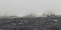 In this photo released by Taiwan's Central News Agency, Japan Coast Guard patrol boats spray their water cannons towards a Taiwan Coast Guard patrol boat and Taiwanese fishing boats near the disputed islands called Senkaku in Japan and Diaoyu in China, in the East China Sea, Tuesday, Sept. 25, 2012. On Tuesday morning, about 50 Taiwanese fishing boats accompanied by 10 Taiwanese surveillance ships came within almost 20 kilometers (about 12 miles) of the disputed islands - within what Japan considers to be its territorial waters. (AP Photo/Central News Agency) TAIWAN OUT