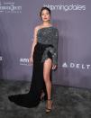 Olivia Culpo dazzled at the amfAR gala in an asymmetric dress by Redemption with a seductive split and glittery details shimmering in the light. New York, February 7, 2018