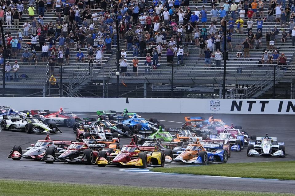 Alex Palou, (10) of Spain, leads the field at the start of the IndyCar Grand Prix auto race at Indianapolis Motor Speedway, Saturday, May 11, 2024, in Indianapolis. (AP Photo/Darron Cummings)