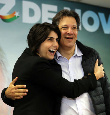 Fernando Haddad (R), former Sao Paulo mayor and member of Workers' Party (PT), and Manuela D'avila of the Communist Party of Brazil (PCdoB) pose before a media conference in Sao Paulo, Brazil August 7, 2018. REUTERS/Paulo Whitaker