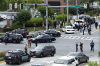 <p>Maryland police officers block the intersection at the building entrance, after multiple people were shot at a newspaper in Annapolis, Md., Thursday, June 28, 2018. (Photo: Jose Luis Magana/AP) </p>