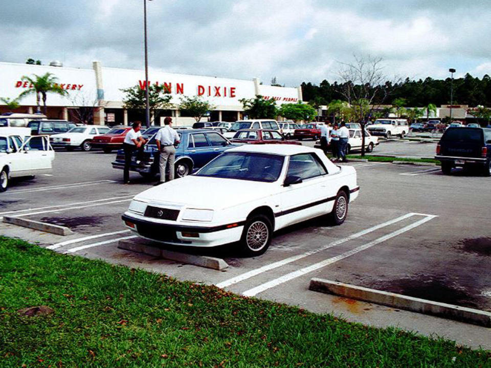 Four days after Marlene Warren was shot, police  found this white Chrysler LeBaron in a parking lot eight miles from the crime scene. Marlene's son Joe Ahrens remembered seeing the clown drive away in a car fitting this description. Inside the car police found orange fibers that resembled hair from a clown wig and several strands of brown human hair. / Credit: Palm Beach County Sheriff's Dept.