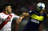 <p>Boca Juniors’ Cristian Pavon in action against River Plate’s Jorge Moreira at the Argentine First Division soccer match at Alberto J. Armando stadium, Buenos Aires, Argentina on May 15, 2017. (Photo: Marcos Brindicci/Reuters) </p>