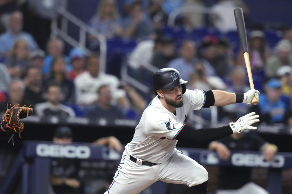 Miami Marlins' Jon Berti follow through on a single against the New York Mets during the fourth inning of a baseball game Wednesday, Sept. 20, 2023, in Miami. (AP Photo/Lynne Sladky)