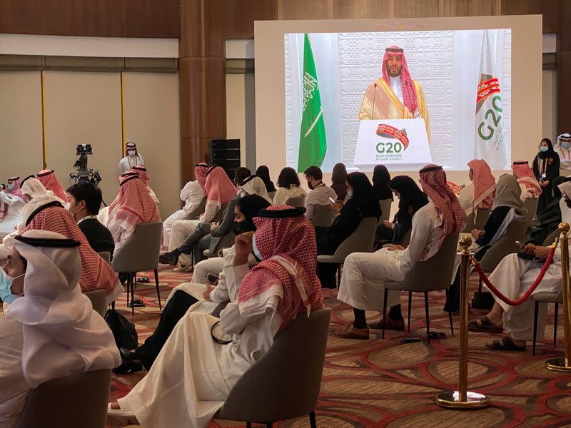 Saudi Crown Prince Mohammed bin Salman's speech is aired live at the media centre of the 15th annual G20 Leaders' Summit in Riyadh