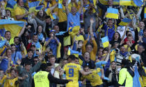 Ukraine's Roman Yaremchuk celebrates after scoring his side's second goal during the World Cup 2022 qualifying play-off soccer match between Scotland and Ukraine at Hampden Park stadium in Glasgow, Scotland, Wednesday, June 1, 2022. (AP Photo/Scott Heppell)