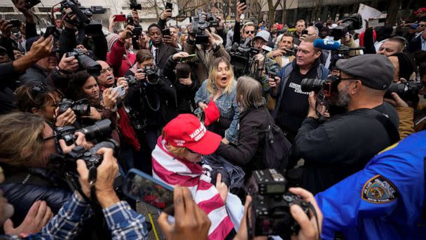 PHOTO: A supporter of former President Donald Trump scuffles with anti-Trump protesters outside the courthouse where Trump will arrive later in the day for his arraignment on April 4, 2023 in New York City. (Drew Angerer/Getty Images)