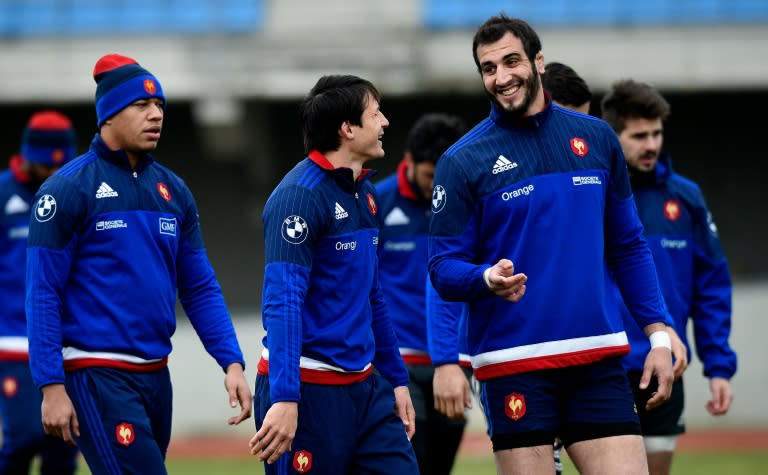 France fly-half Francois Trinh-Duc (C) jokes with lock Yoann Maestri during a training session in Marcoussis, south of Paris, on March 8, 2016