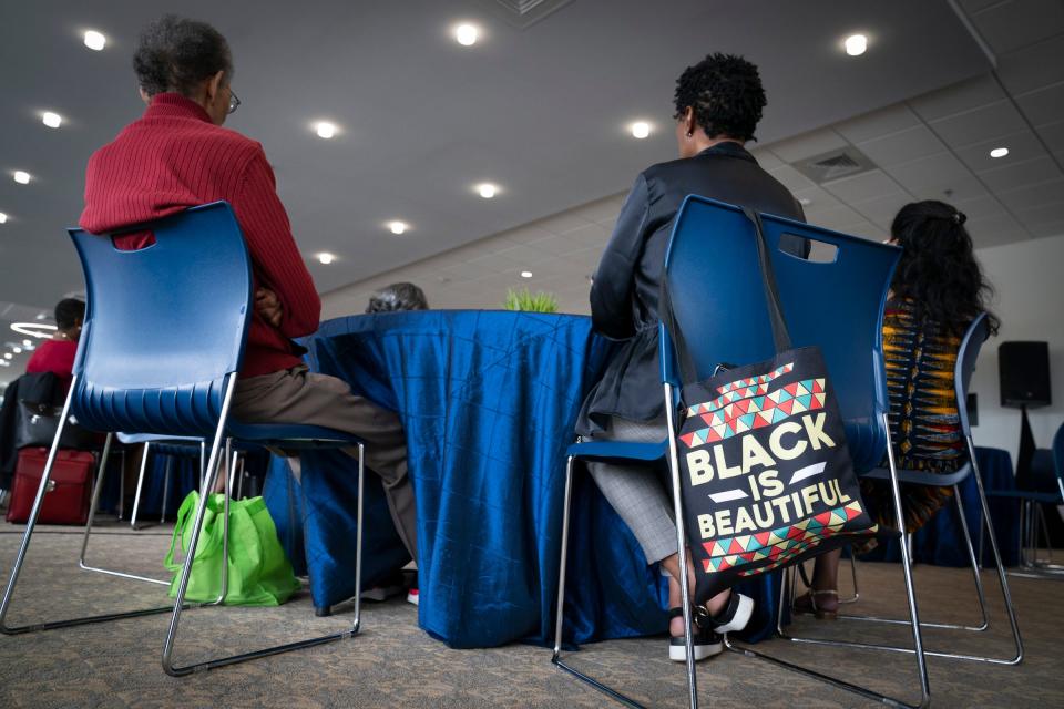 Attendees listen to a panel during the Freedom Walk Summit Thursday, June 22, 2023, at the Wayne County Community College District-Northwest Campus in the Denise Wellons-Glover Welcome Center.