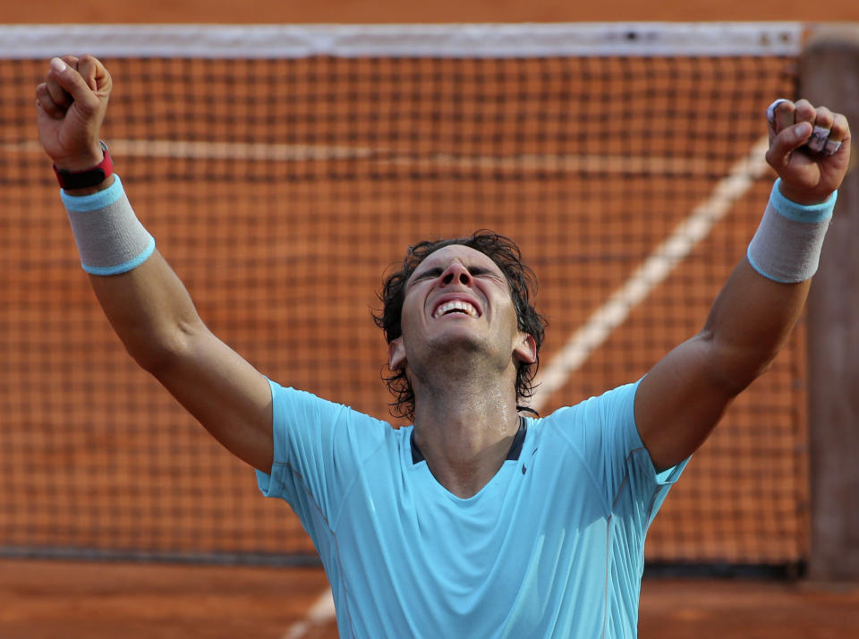 Spain's Rafael Nadal reacts after defeating Serbia's Novak Djokovic in their final match of  the French Open tennis tournament at the Roland Garros stadium, in Paris, France, Sunday, June 8, 2014. (AP Photo/Thibault Camus)