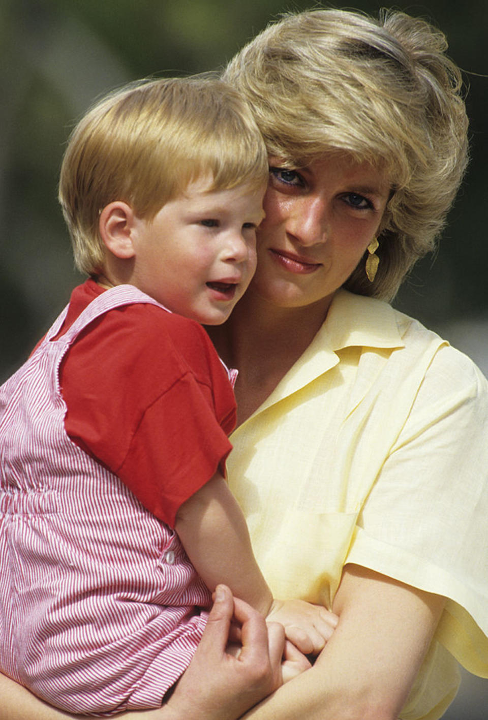 Diana, Princess of Wales holds a young Prince Harry on holiday in Majorca, Spain on August 10, 1987