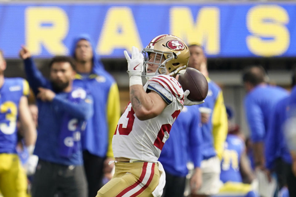 San Francisco 49ers running back Christian McCaffrey passes for a touchdown on a trick play during the first half of an NFL football game against the Los Angeles Rams Sunday, Oct. 30, 2022, in Inglewood, Calif. (AP Photo/Ashley Landis)